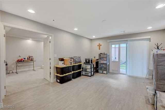 interior space featuring recessed lighting, wood finished floors, and baseboards