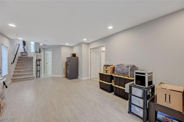 interior space featuring recessed lighting, light wood-type flooring, and baseboards