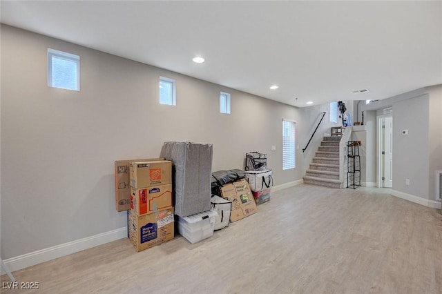 basement featuring stairway, recessed lighting, wood finished floors, and baseboards