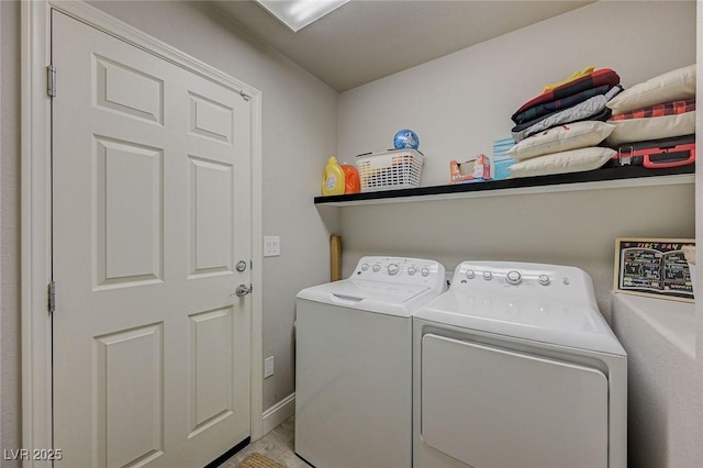 washroom featuring laundry area and washer and clothes dryer