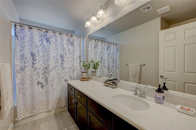 full bath featuring visible vents and vanity