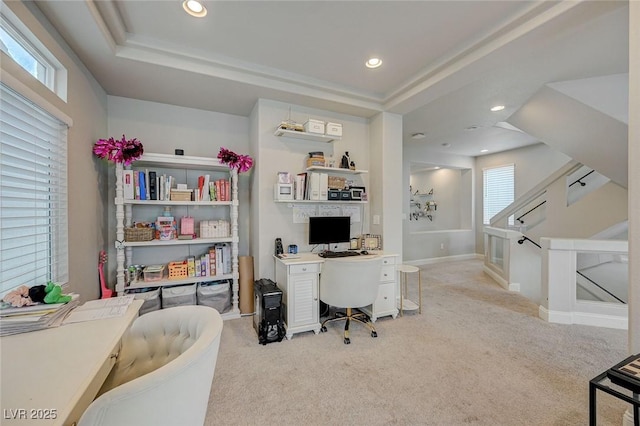 office area with recessed lighting, light colored carpet, a raised ceiling, and baseboards