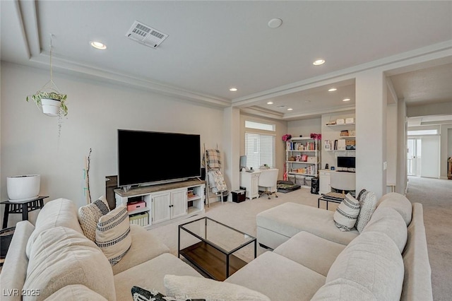 carpeted living area with recessed lighting and visible vents