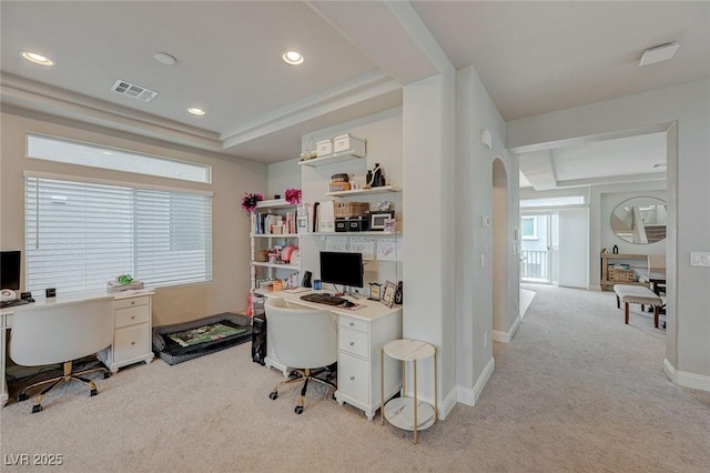 office space with visible vents, baseboards, light carpet, recessed lighting, and arched walkways