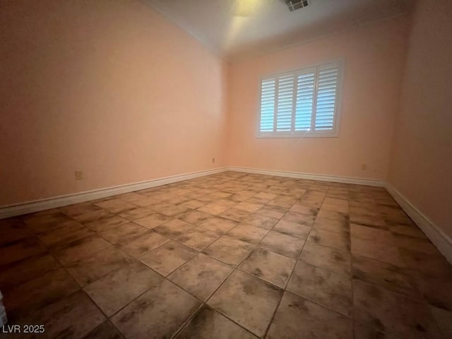 unfurnished room featuring lofted ceiling