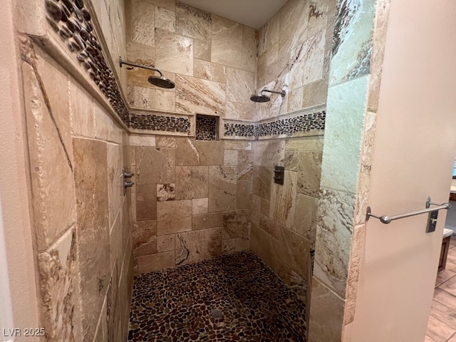 bathroom featuring a tile shower