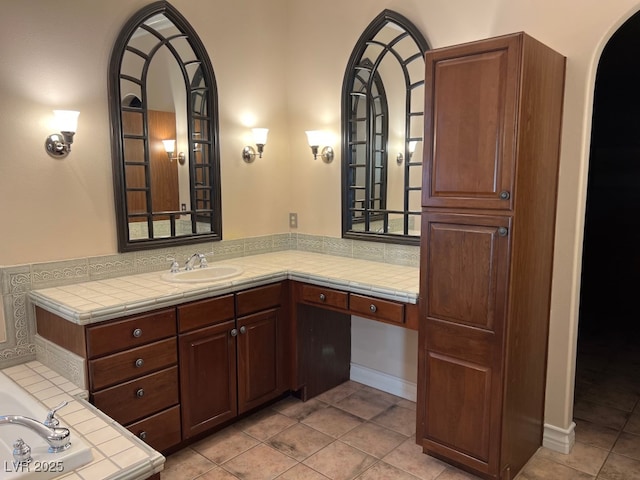 bathroom with tile patterned floors and vanity