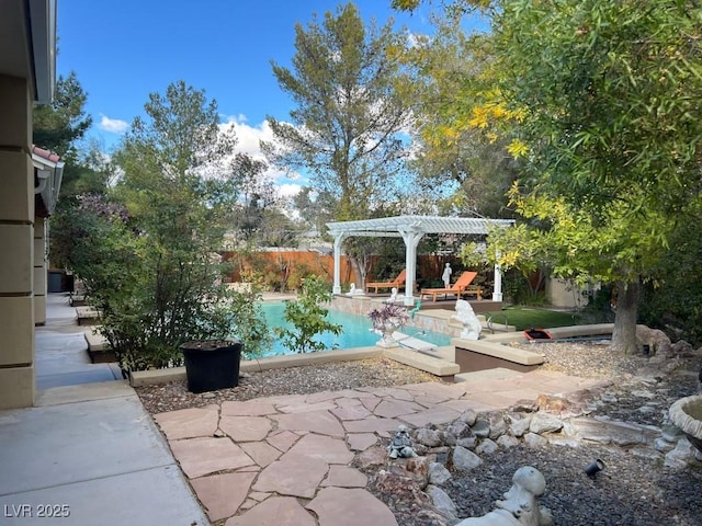 view of pool with a pergola and a patio