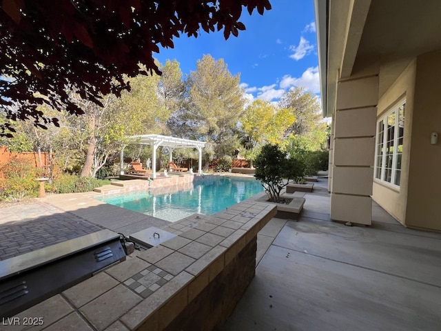 view of swimming pool with a pergola and a patio