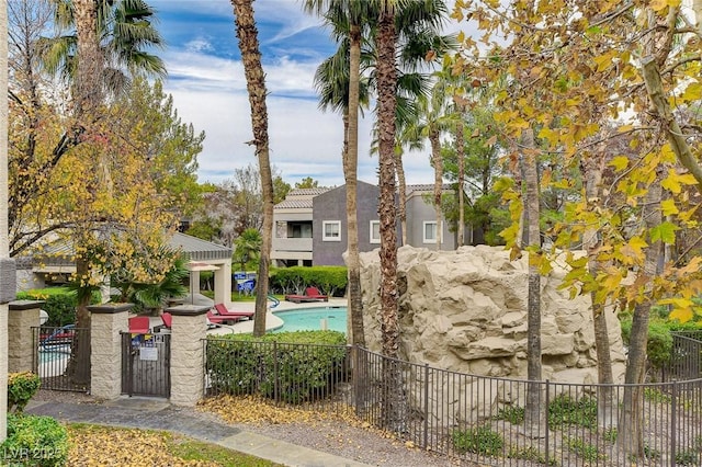 exterior space featuring a fenced in pool