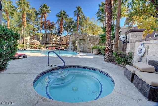 view of pool featuring a community hot tub