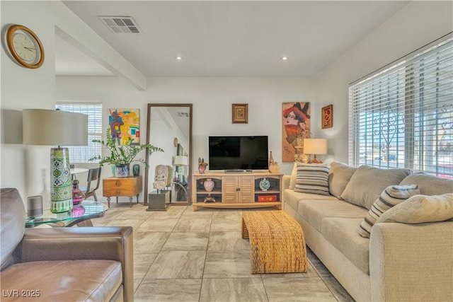 living area with visible vents and recessed lighting