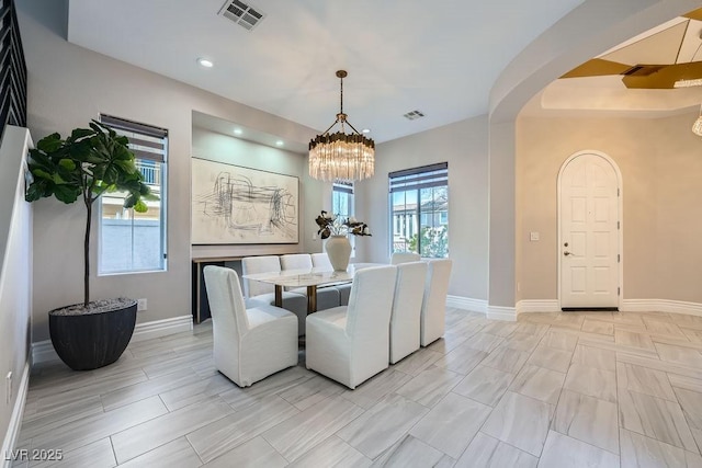 dining space featuring a notable chandelier