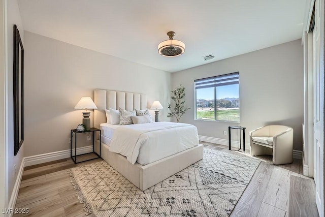 bedroom featuring light hardwood / wood-style floors