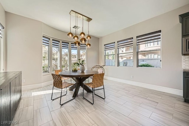 dining area with a notable chandelier