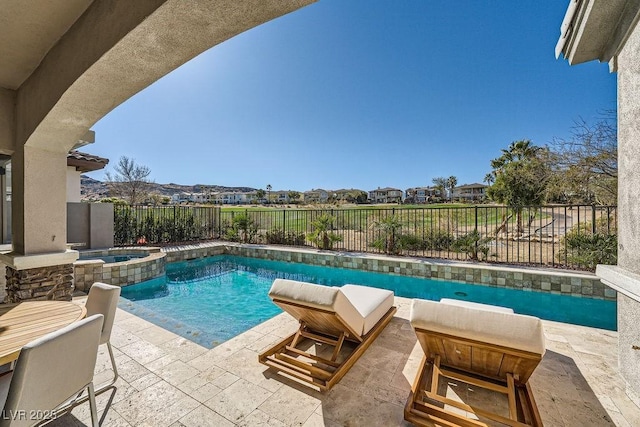 view of pool with an in ground hot tub and a patio area