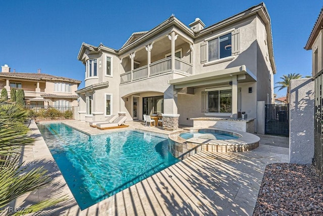 back of house with a pool with hot tub and a patio area