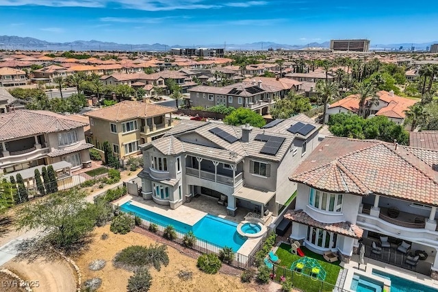 birds eye view of property featuring a mountain view