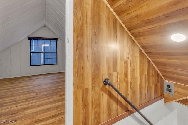 additional living space featuring wood ceiling, vaulted ceiling, and hardwood / wood-style floors