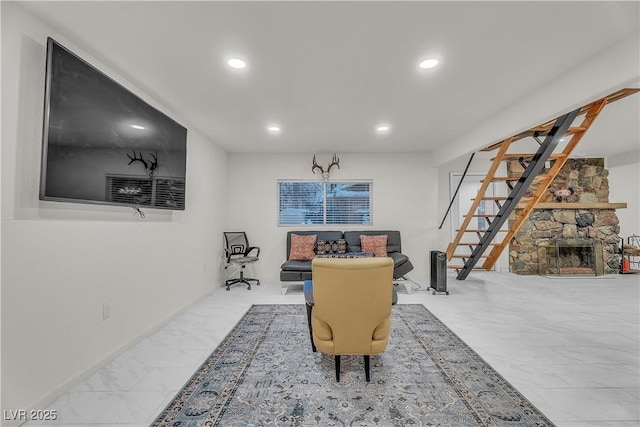 dining room with a stone fireplace