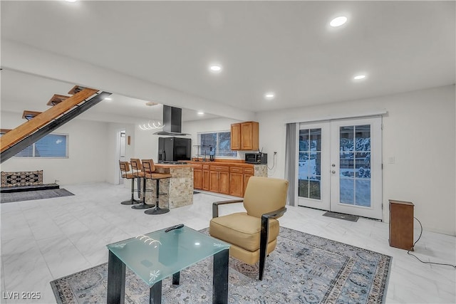 living room with sink and french doors