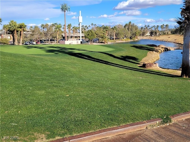 view of property's community featuring a water view and a yard