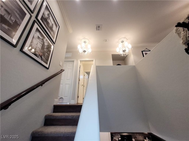 stairs with ornamental molding and visible vents