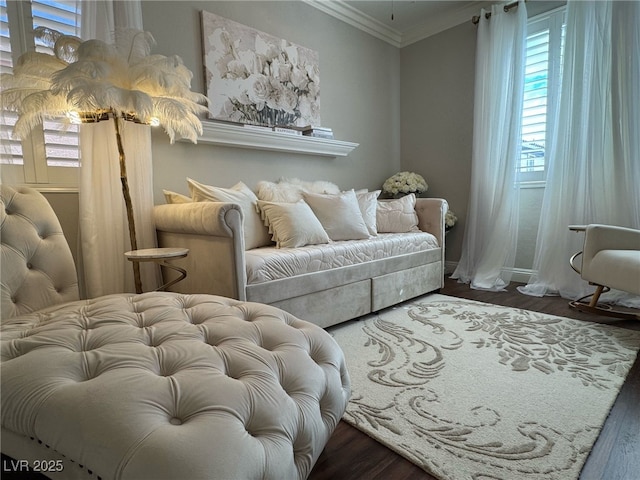 living area with ornamental molding and dark wood finished floors