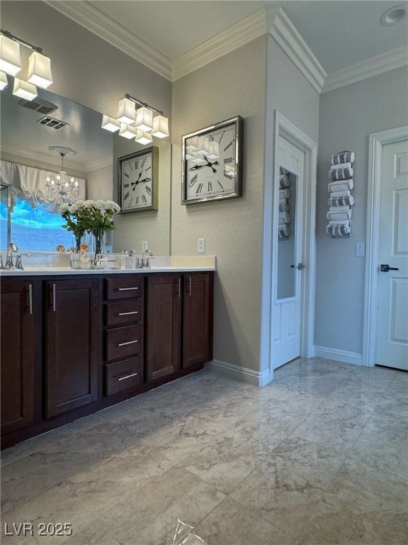 full bathroom with baseboards, double vanity, and crown molding