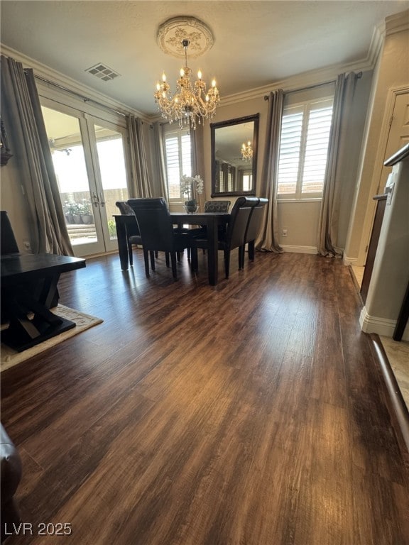 dining area with visible vents, dark wood-style flooring, a wealth of natural light, and crown molding