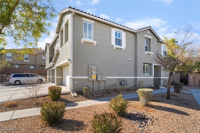 view of side of home featuring a garage