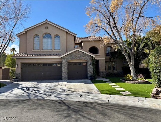 mediterranean / spanish-style house with a garage and a front lawn