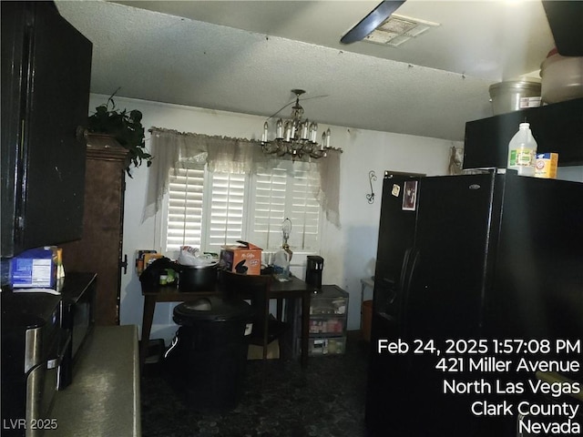421 Miller Ave, North Las Vegas, NV 89030 - dining area with visible vents, a textured ceiling, and a notable chandelier