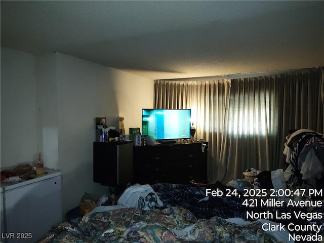 421 Miller Ave, North Las Vegas, NV 89030 - bedroom featuring refrigerator