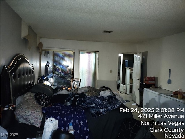 421 Miller Ave, North Las Vegas, NV 89030 - bedroom featuring a textured ceiling and visible vents