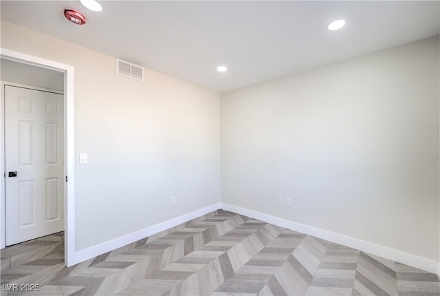 unfurnished room with light parquet floors