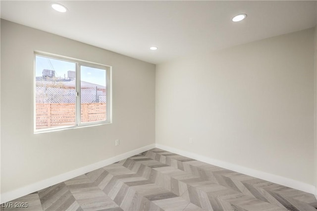 spare room with light parquet flooring