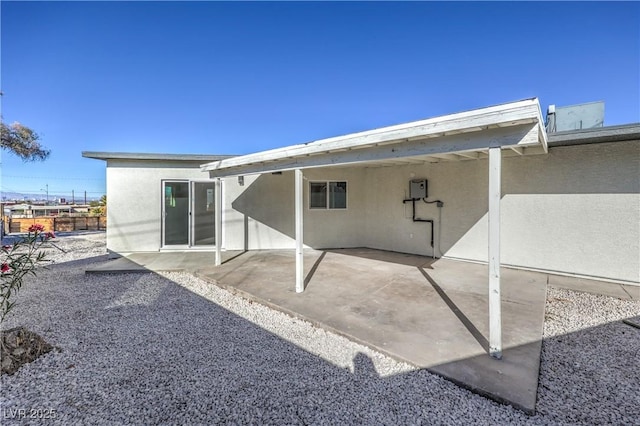 back of property with a patio area