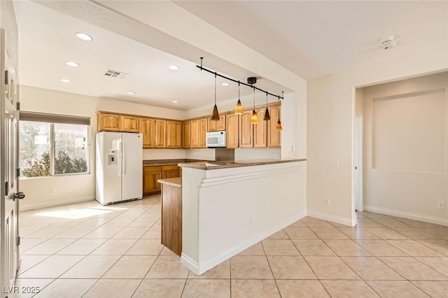 kitchen featuring light tile patterned floors, recessed lighting, visible vents, white appliances, and a peninsula