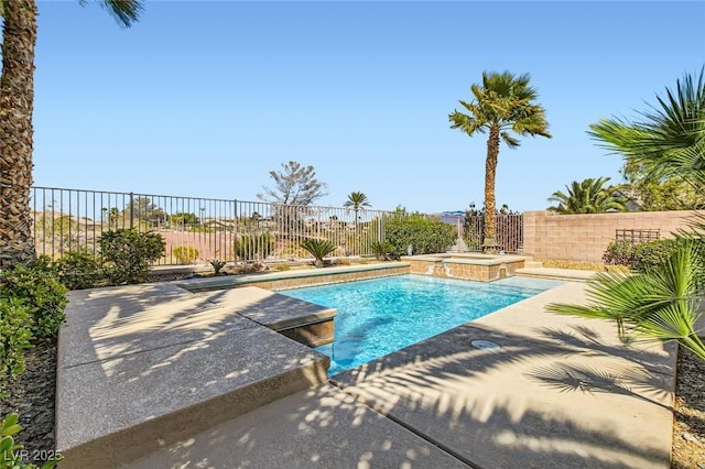 view of swimming pool with a fenced in pool, a patio area, a fenced backyard, and an in ground hot tub