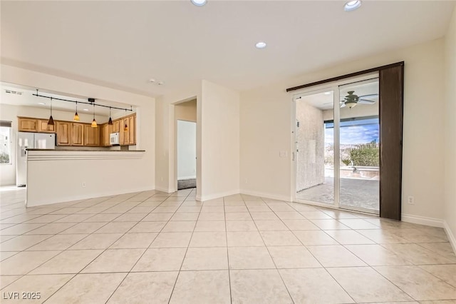 unfurnished living room featuring light tile patterned floors, baseboards, a ceiling fan, and recessed lighting