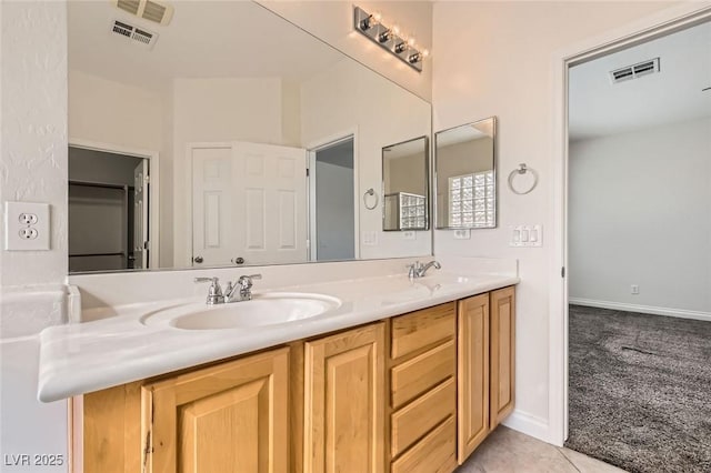 full bath with double vanity, a sink, visible vents, and tile patterned floors