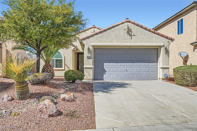 view of front of home with concrete driveway, a tiled roof, an attached garage, and stucco siding