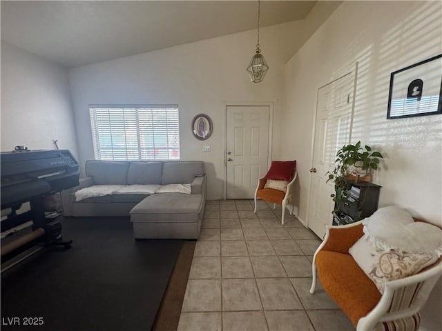 tiled living room with lofted ceiling