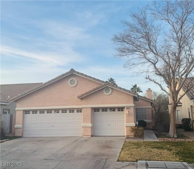 ranch-style house featuring a garage