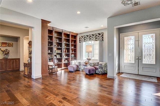 entrance foyer featuring french doors and dark hardwood / wood-style floors