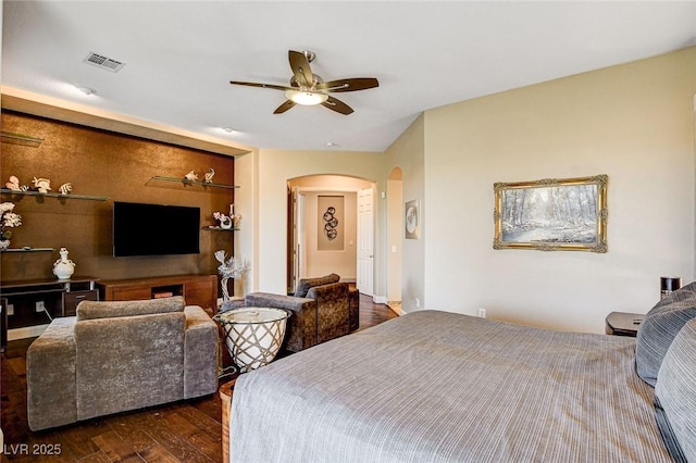 bedroom with ceiling fan and dark hardwood / wood-style floors