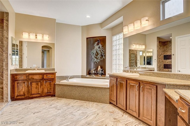 bathroom with vanity and plus walk in shower