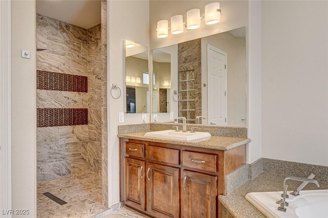 bathroom featuring vanity and shower with separate bathtub