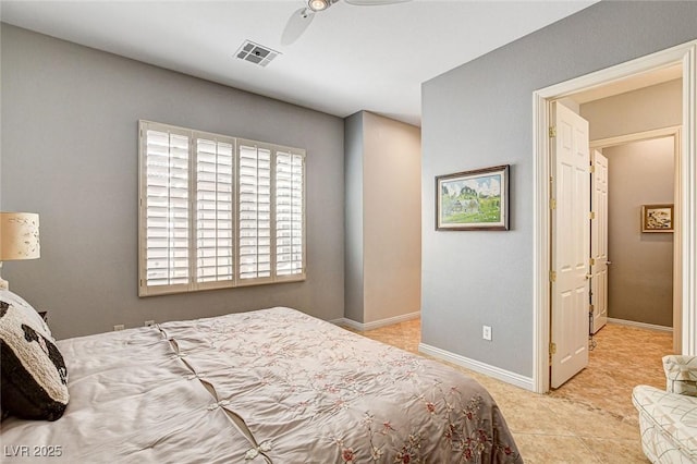 tiled bedroom with ceiling fan